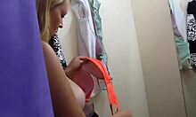 Tanned blonde looking hot in a dressing room